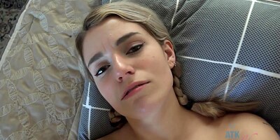 Cute blonde babe with small, natural tits is sucking dick and rubbing it with her feet