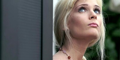 A blonde with blue eyes that loves to fool around is masturbating