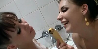 Lesbians have fun in the bathroom with the help of banana