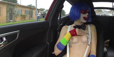 Clown girl sucks cock in a car like a real circus freak