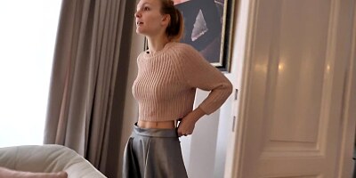 Petite young lady showing off her slender body