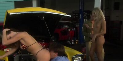 Two lucky car mechanics are fucking two ravishing blondes in the garage
