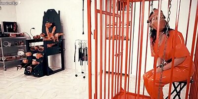Latex Prison Girl In Cuffs And Cage