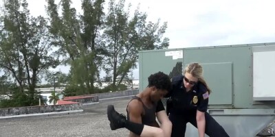 Busty female cops are fucking with black suspect on the roof