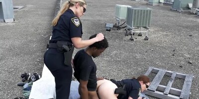 Two chubby female cops fucking with a black man on the roof