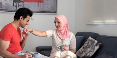Hot Muslim babe in hijab is getting seduced on a couch