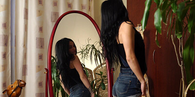 Russian slender Rita Raven caresses herself in front of a mirror