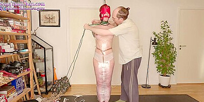Girl Is Mummified In Plastic Wrap To Pole With Magic Wand